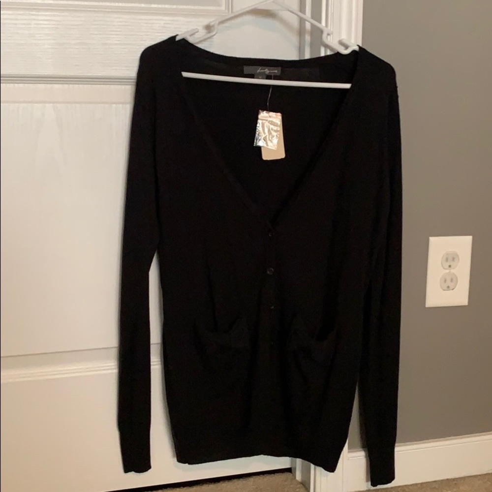 Long black cardigan with bow pockets. Never worn.